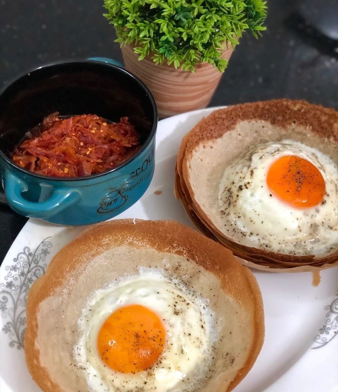 Egg Appam with Chicken Gravy
